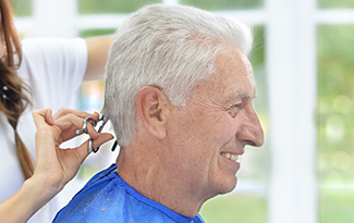 a resident getting their hair cut