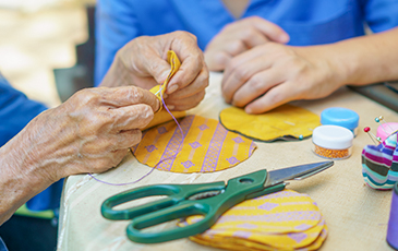 Resident doing crafts