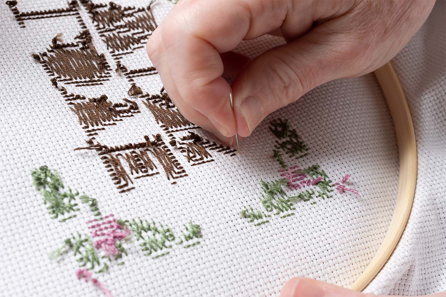 Resident doing stitching