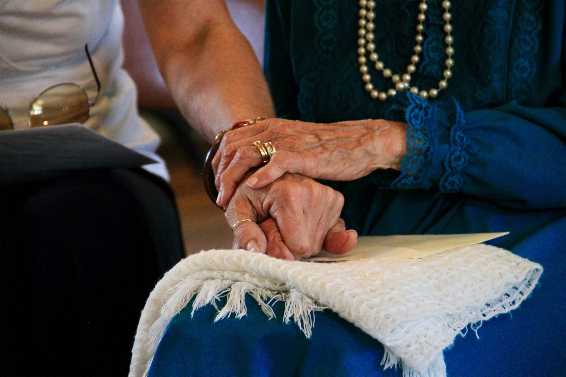 Resident holding hands