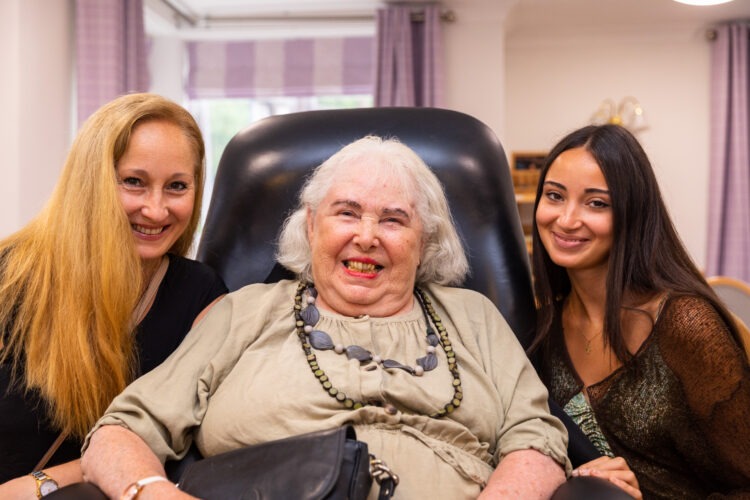 resident smiling with loved ones