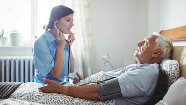 Nursing taking blood pressure