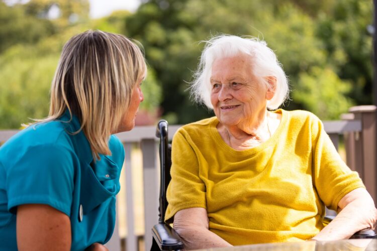 Resident and carer. outside
