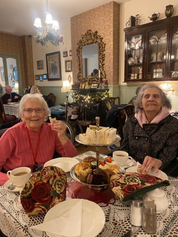 residents enjoying tea and cake on a day out